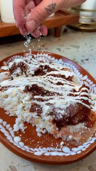 Delicious Mexican mole served over rice with cheese
