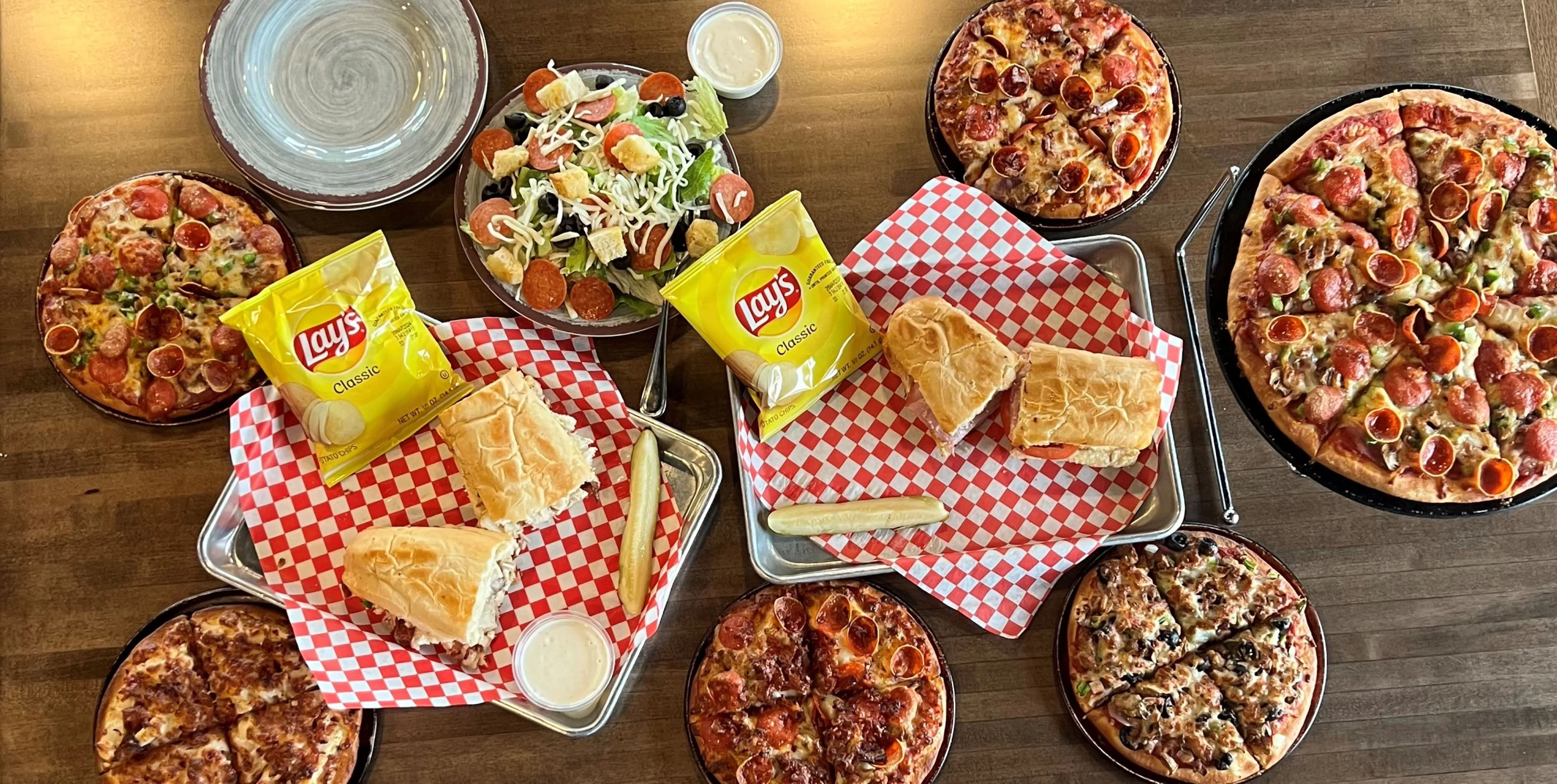 Baked Subs, Salads, Pizzas, French Fries, Hot Wings, Cheese Bread