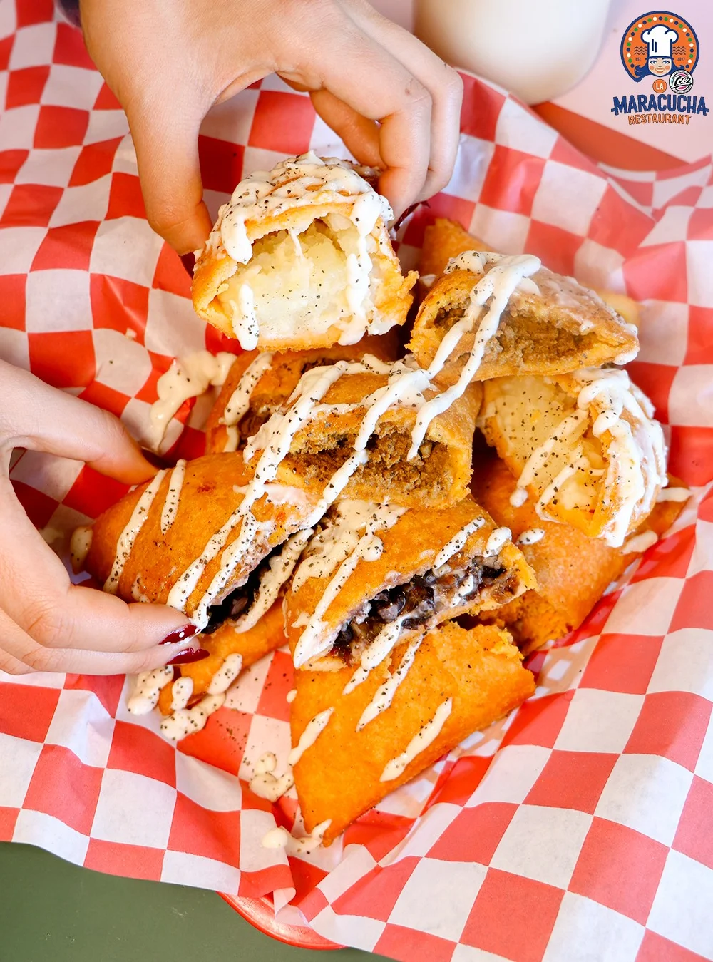 Crispy Mexican empanadas drizzled with creamy sauce