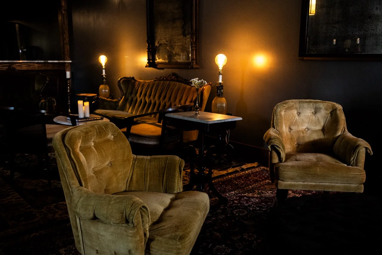 Cozy restaurant interior with vintage seating and warm lighting