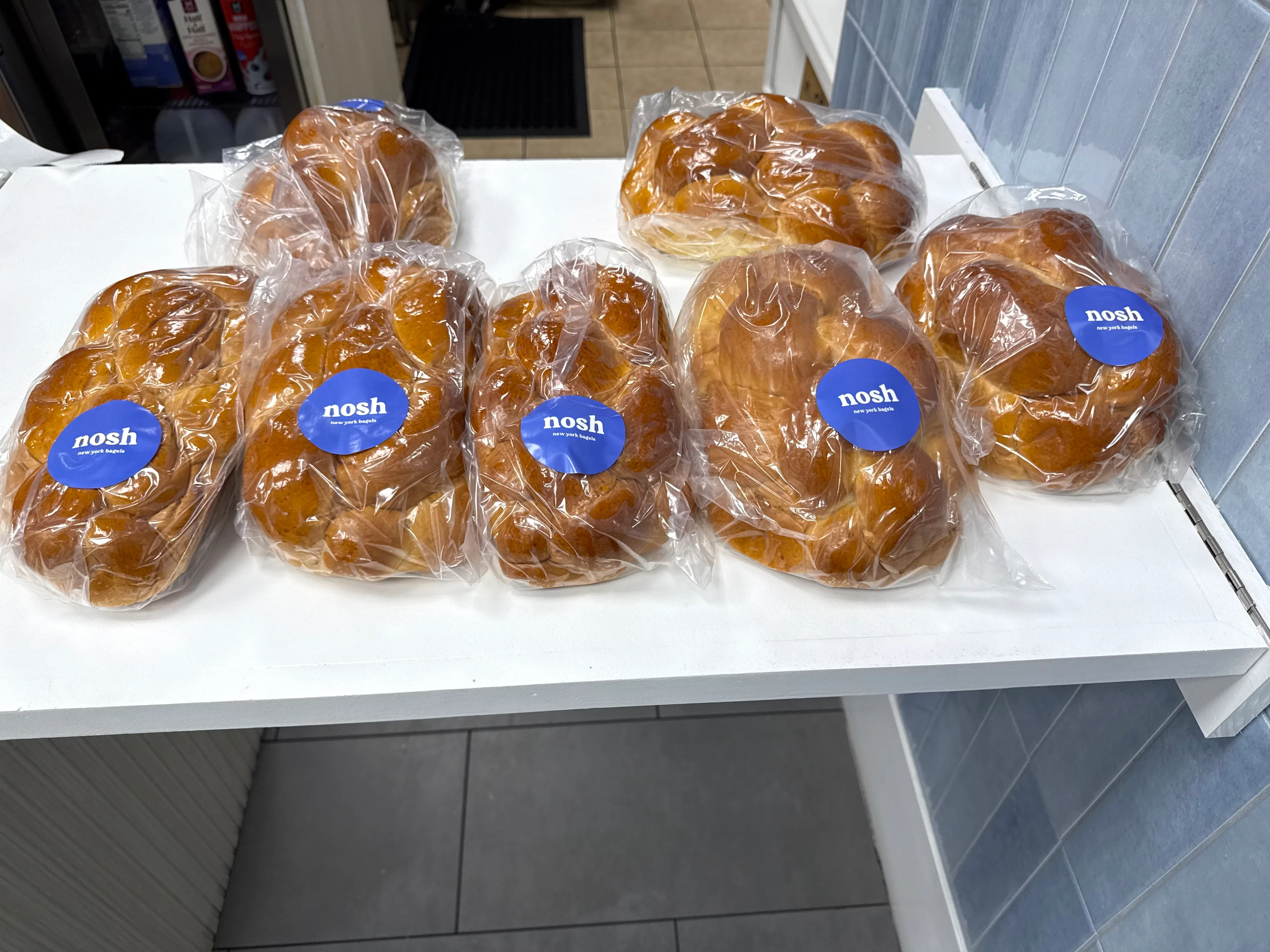 Traditional braided challah bread available for the Jewish holidays at nosh NY bagels