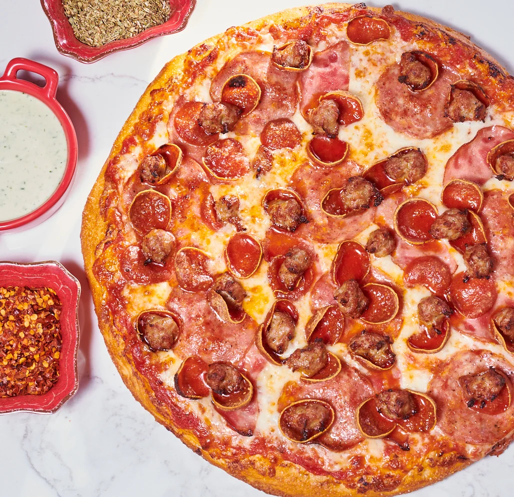 Pepperoni, ham, salami and sausage pizza from namaste pizza in oakland