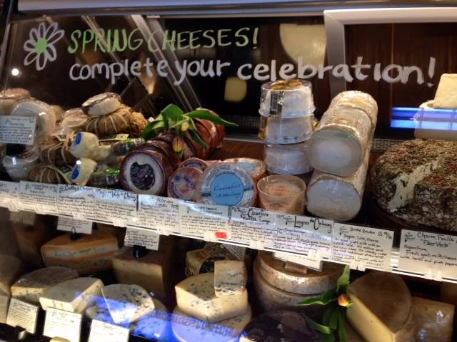 Artisan cheese selection in a gourmet shop display