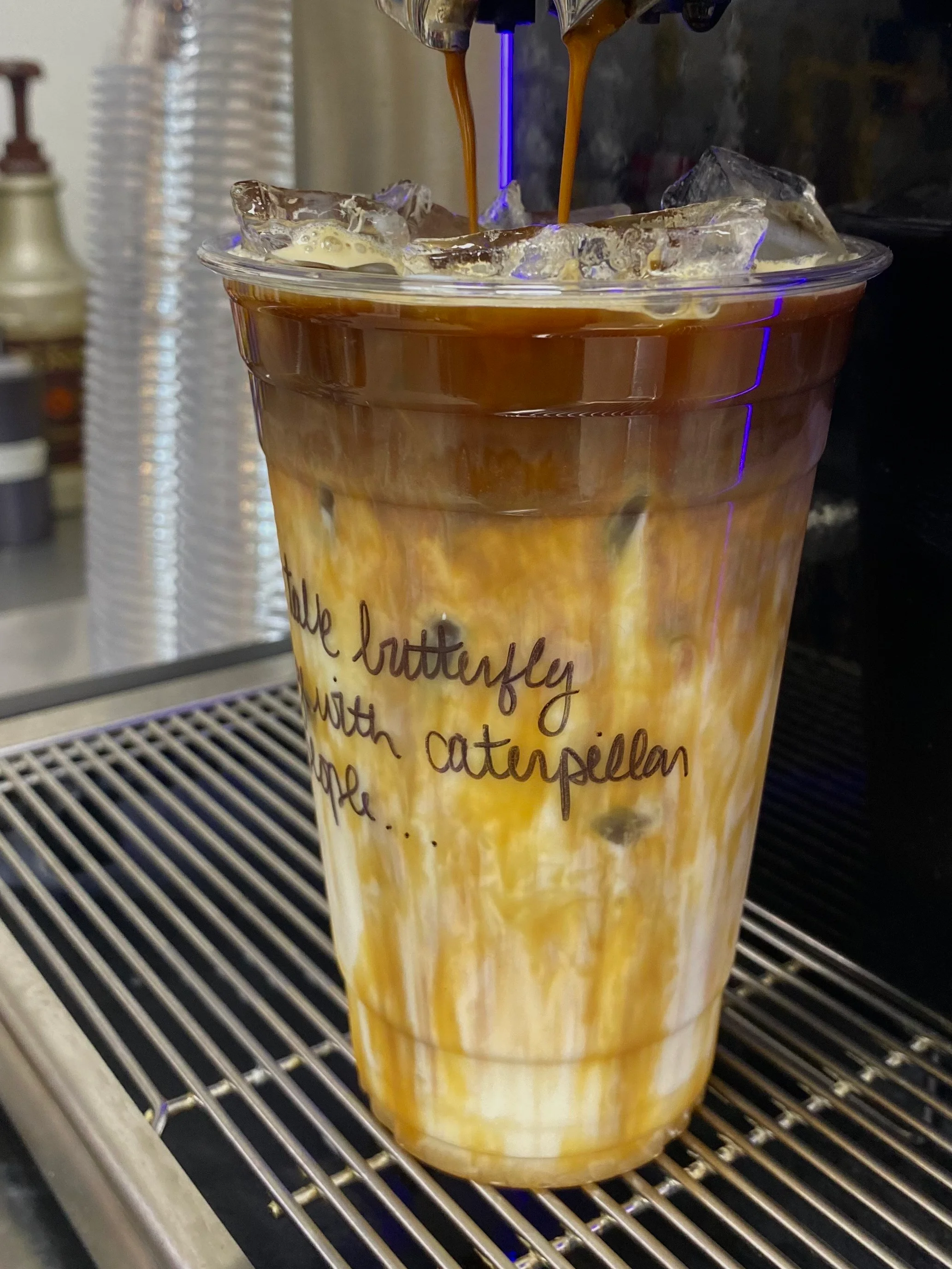Iced coffee drink with layered milk and espresso