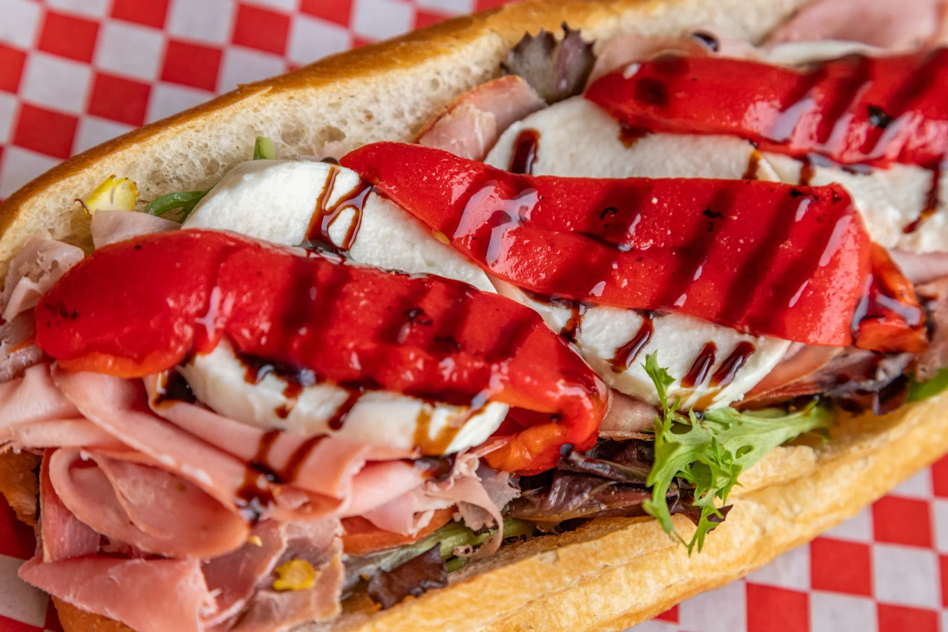 Italian hoagie sandwich with fresh mozzarella and roasted peppers