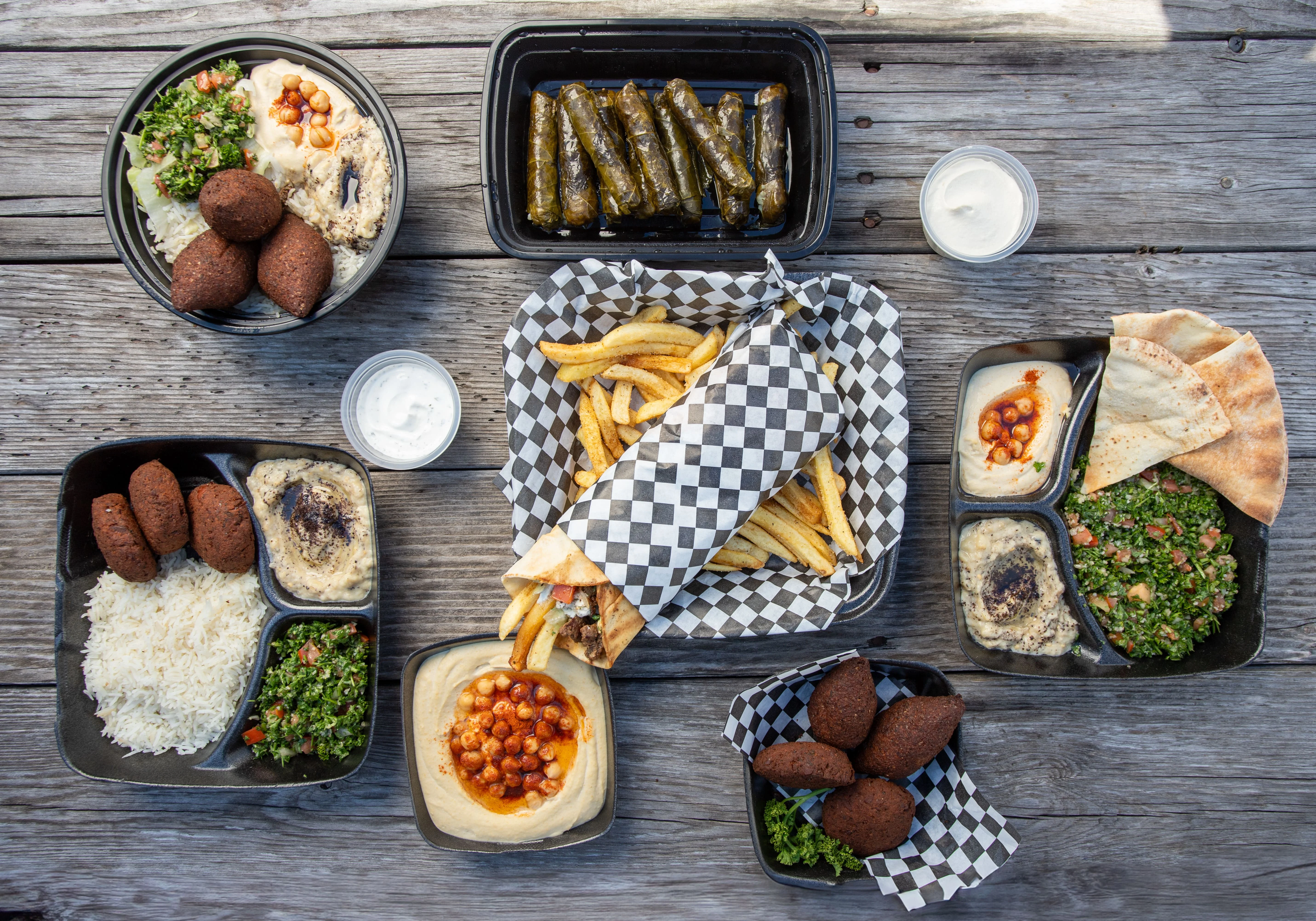 Mediterranean platter with falafel, hummus, and stuffed grape leaves