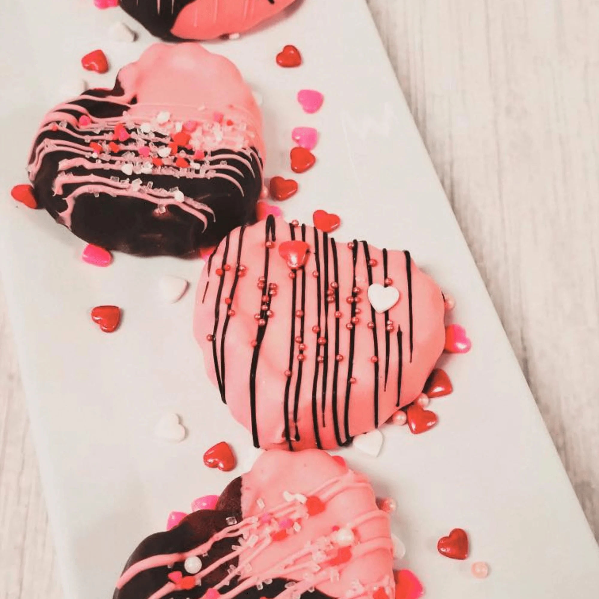 Heart-shaped chocolate cookies decorated for Valentine's Day