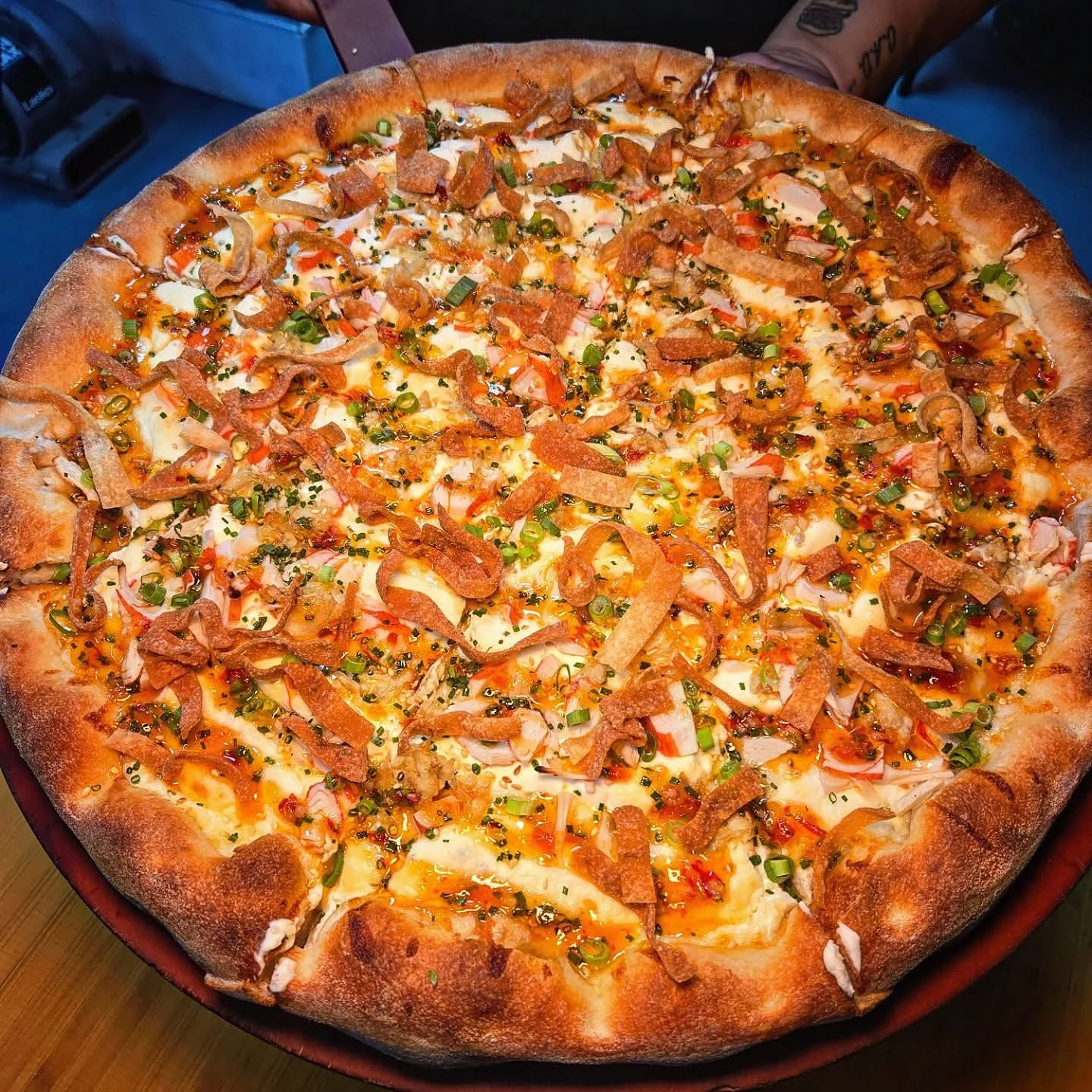 Loaded pizza with shrimp and bacon, a fusion delight