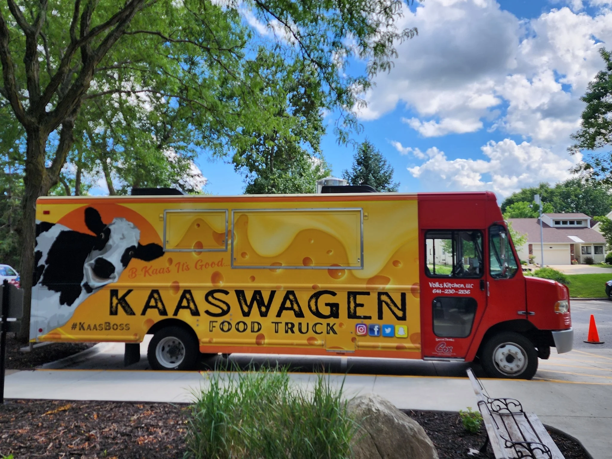 Colorful food truck named Kaaswagen with cow design