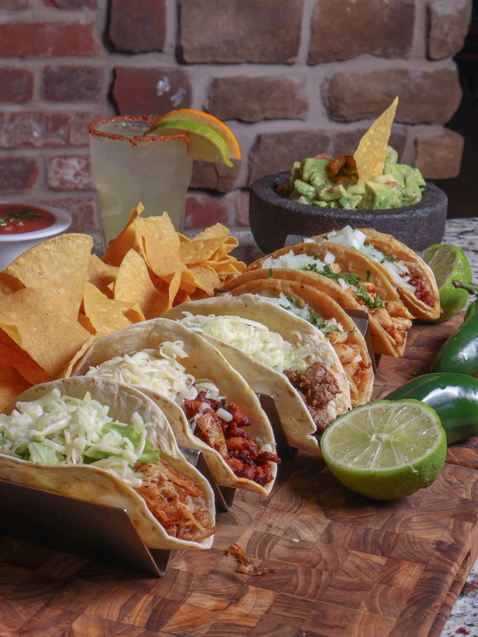 Assorted Mexican tacos with guacamole and tortilla chips