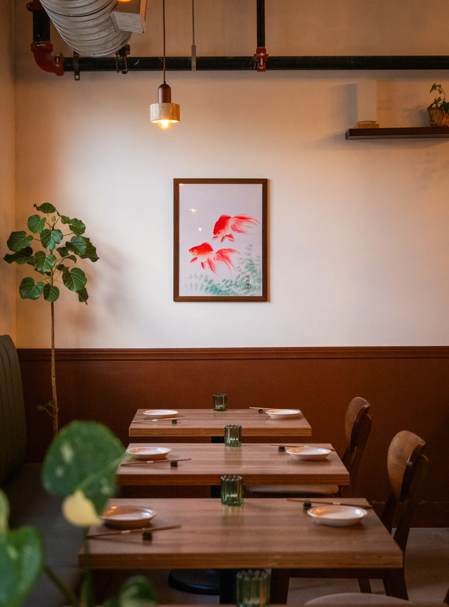 Cozy restaurant interior with warm lighting and artistic decor
