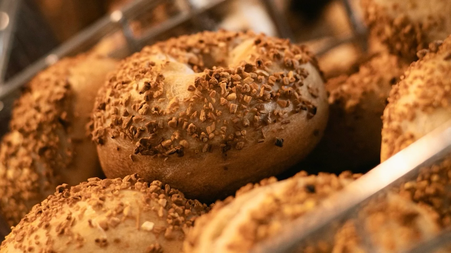 Freshly baked bagels topped with crunchy seeds
