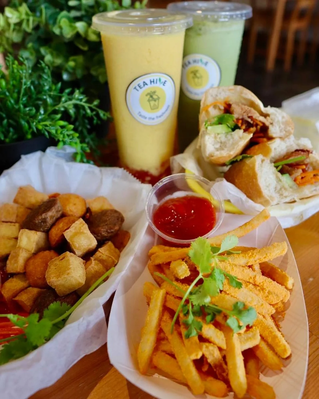 Delicious sandwich platter with fries and refreshing drinks