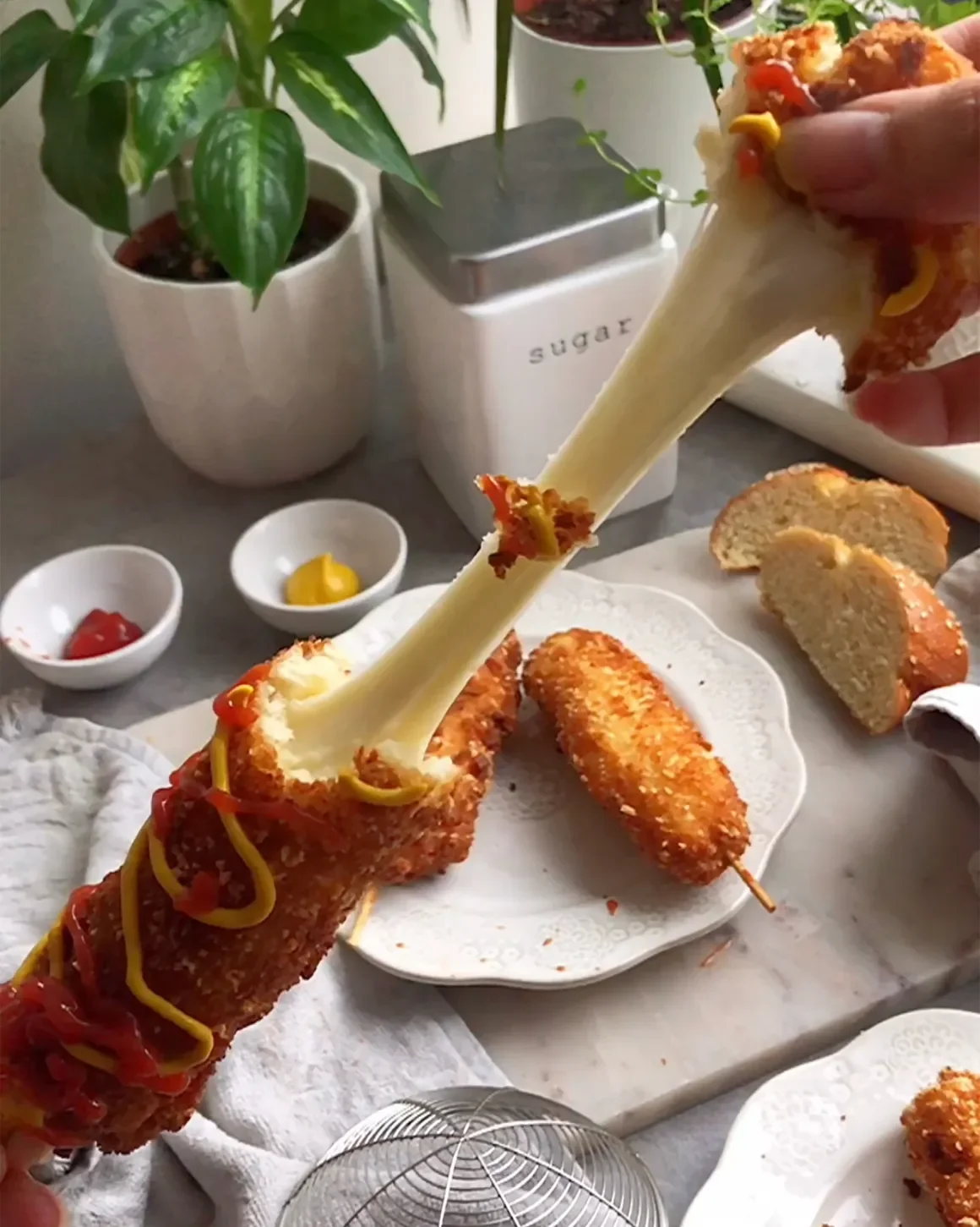 Cheesy Korean corn dog drizzled with ketchup and mustard