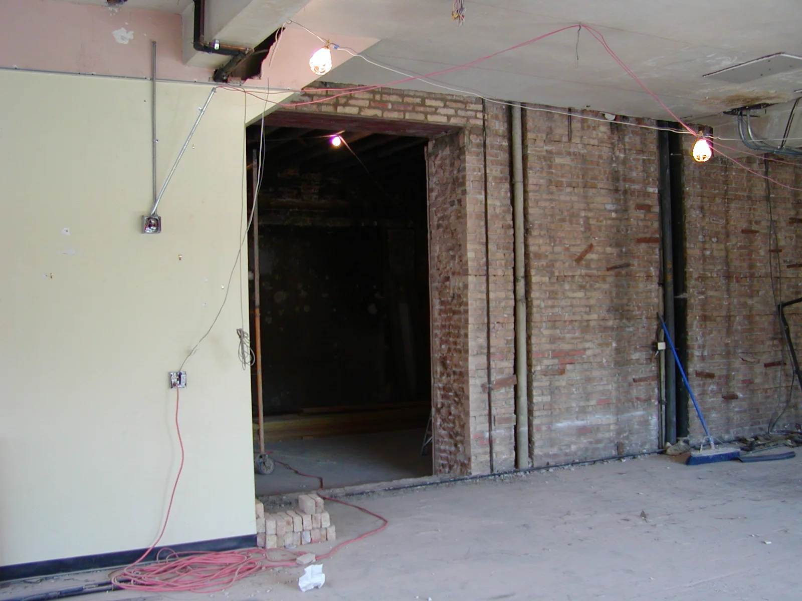 Construction site with exposed brick and electrical wiring