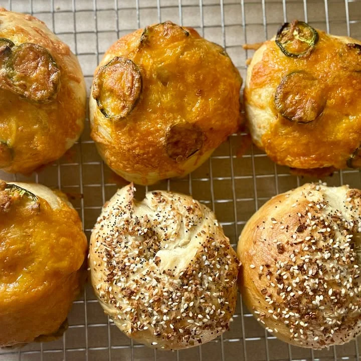 Savory cheese scones with jalapeños and sesame seeds on a cooling rack