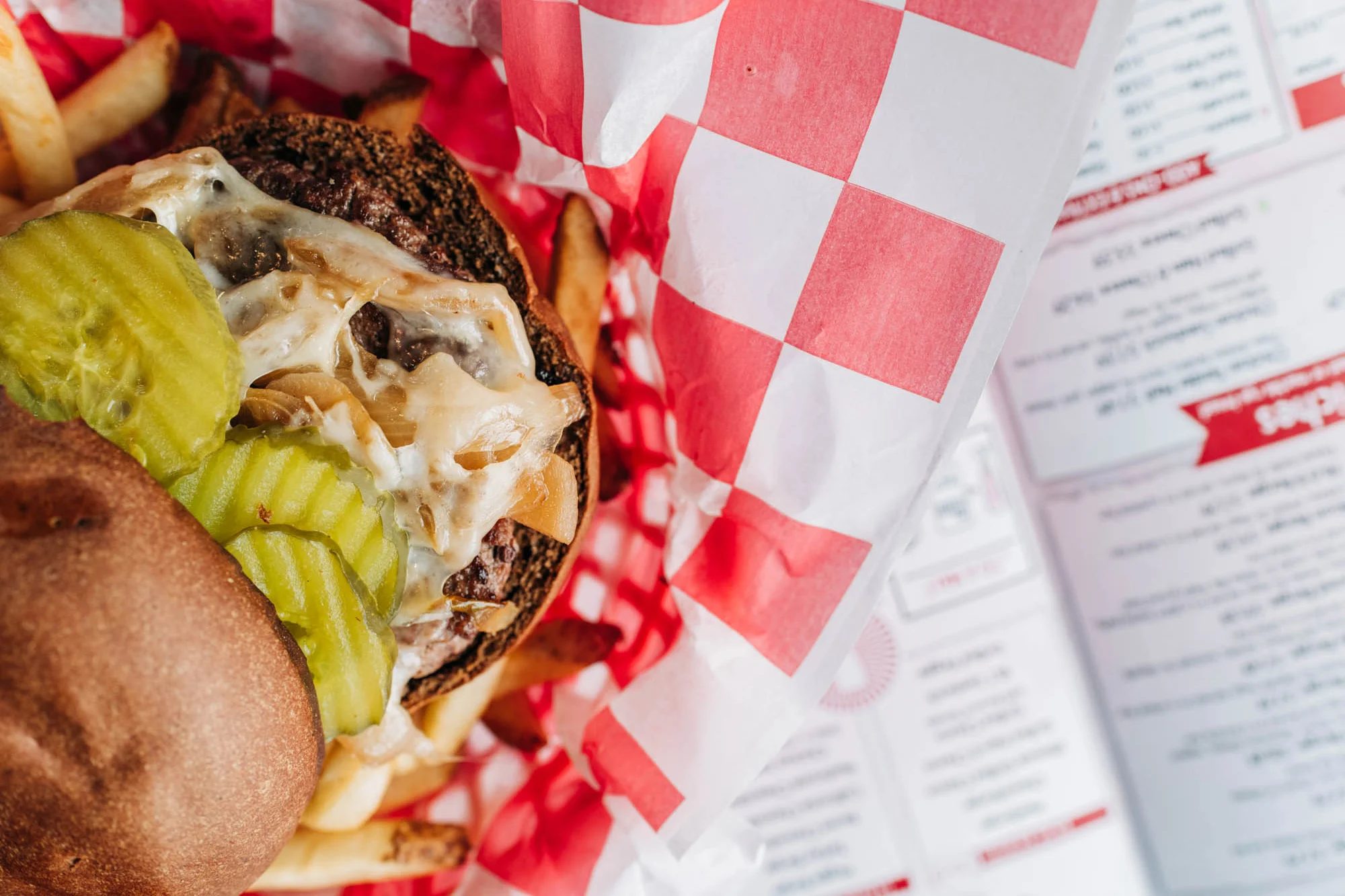 Classic American cheeseburger with fries in a diner setting
