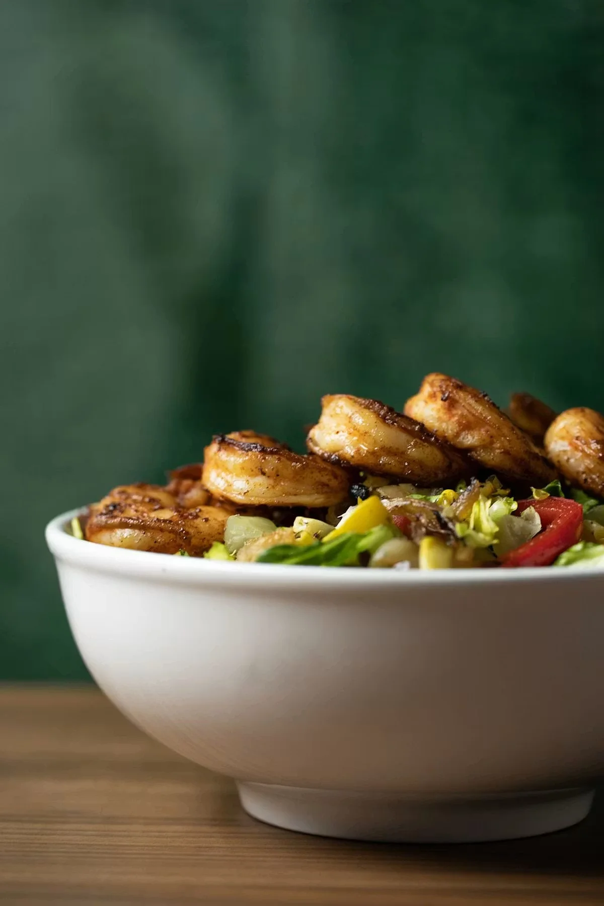 Grilled shrimp salad in a vibrant bowl