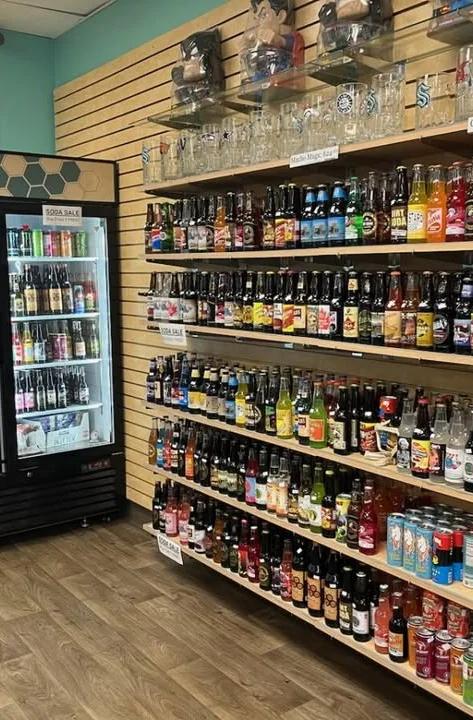 Variety of sodas and drinks on display in a retail store