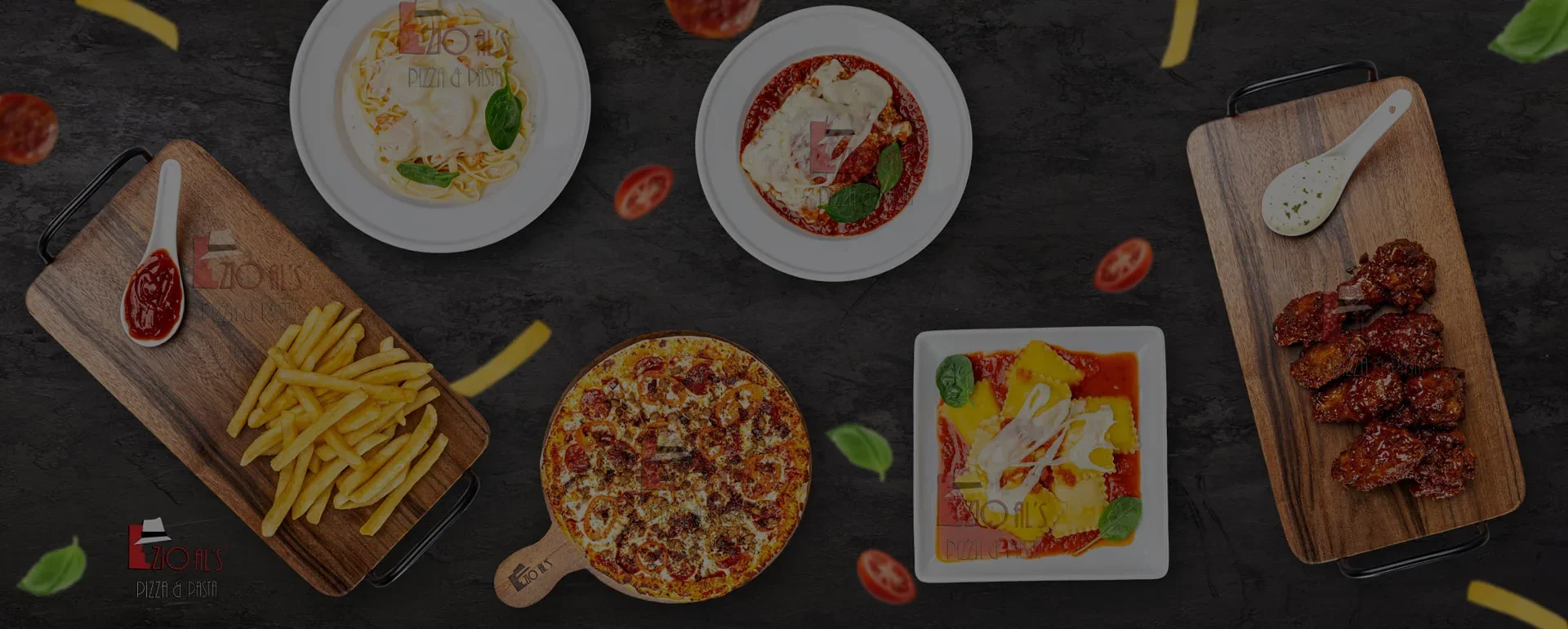 Italian pasta dishes with pizza and wings on a rustic table