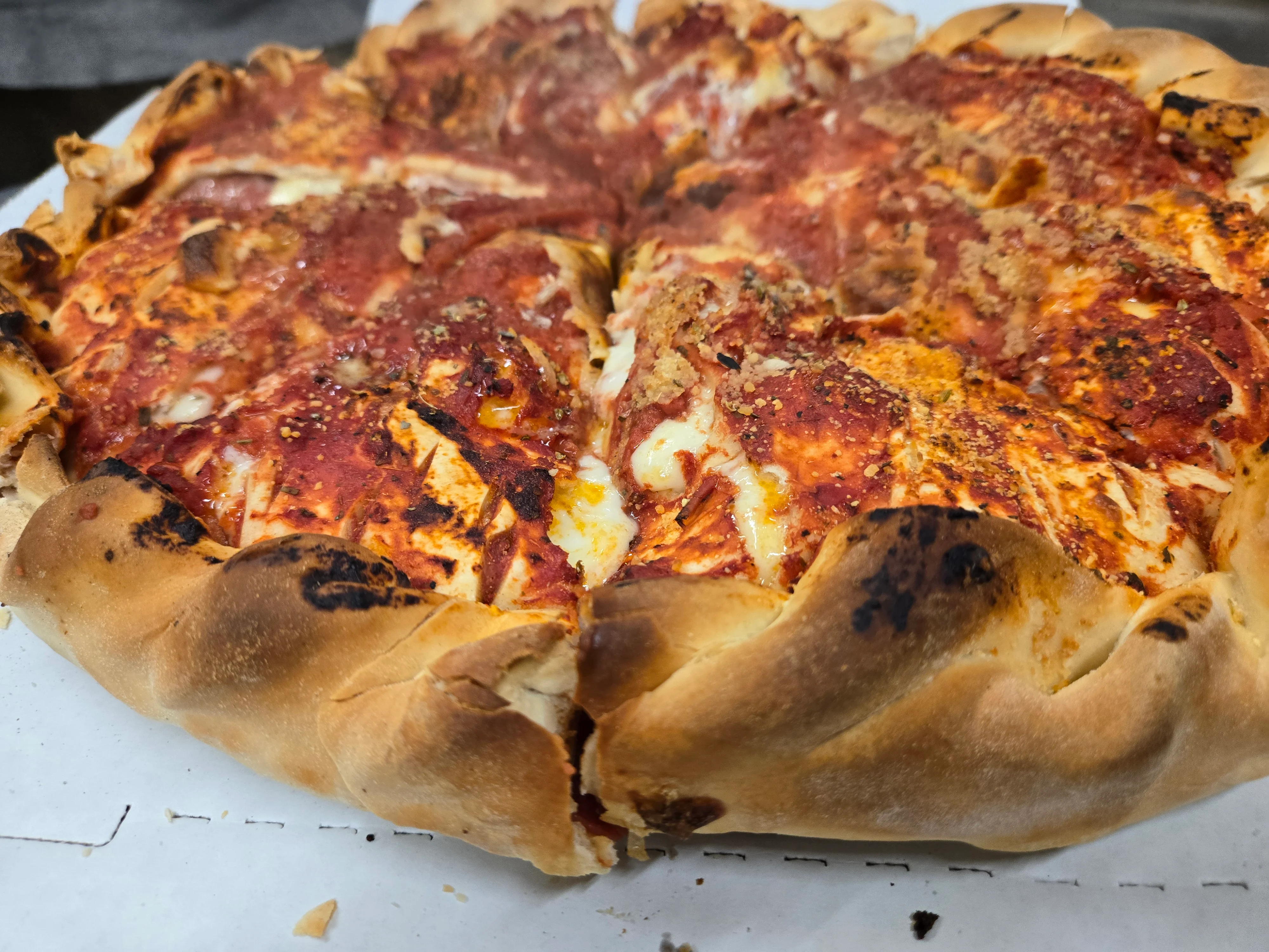 Deep-dish Chicago-style pizza with a golden crust