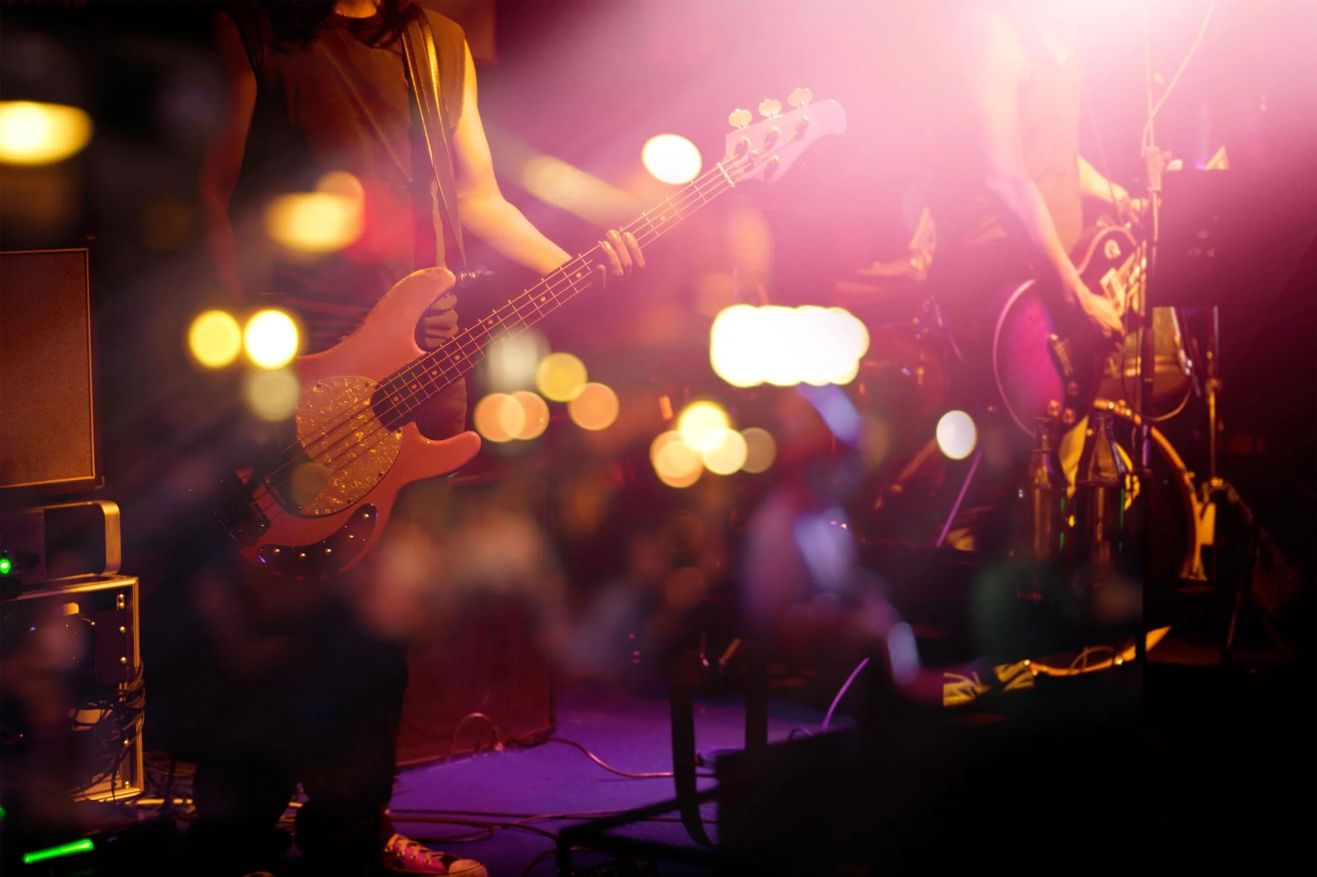 Live music performance with a bassist on stage