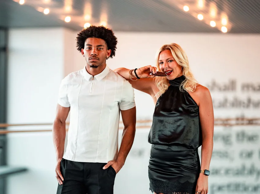 Stylish couple posing in modern restaurant setting