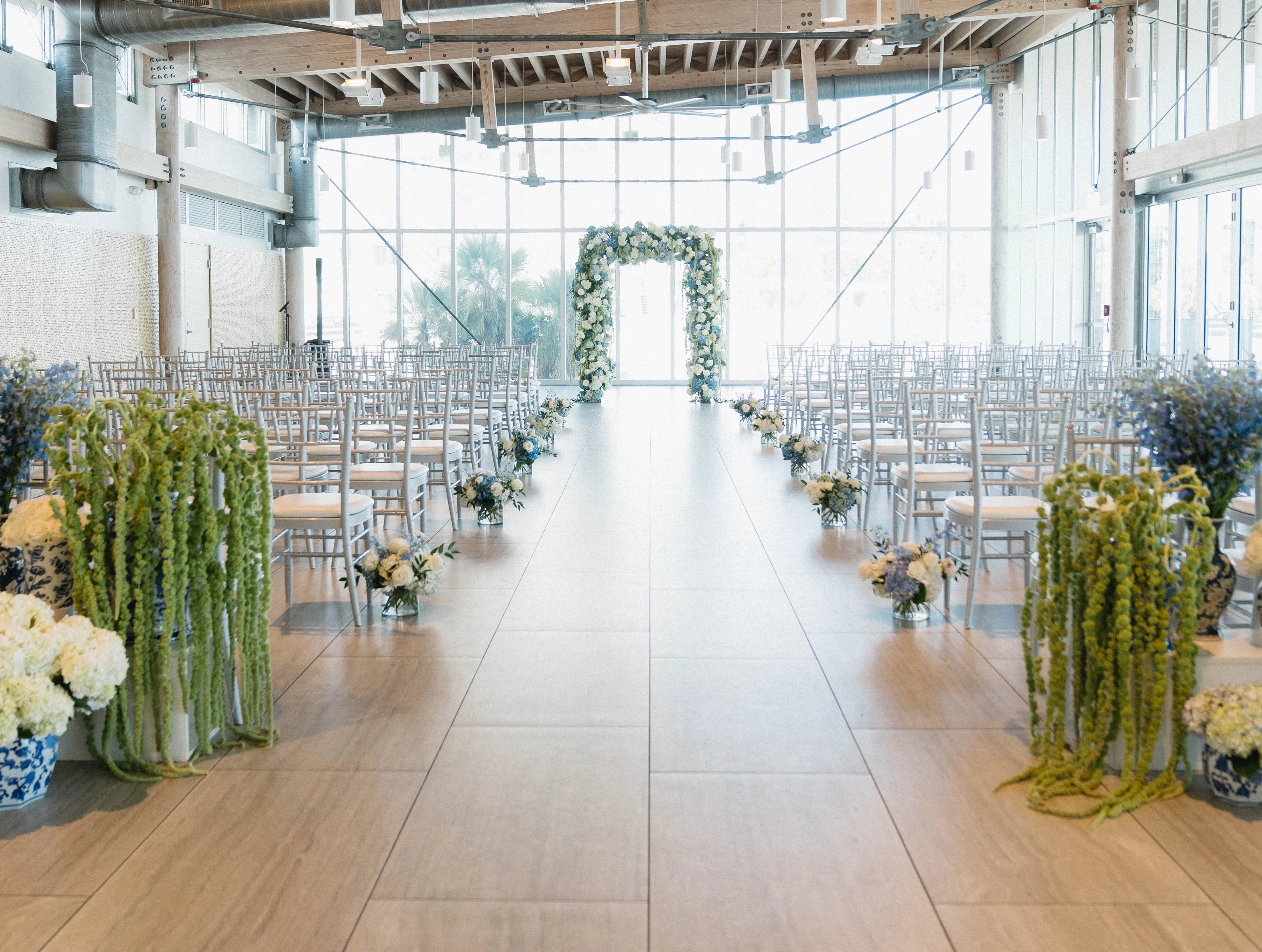 Elegant wedding ceremony setup with floral decorations and seating