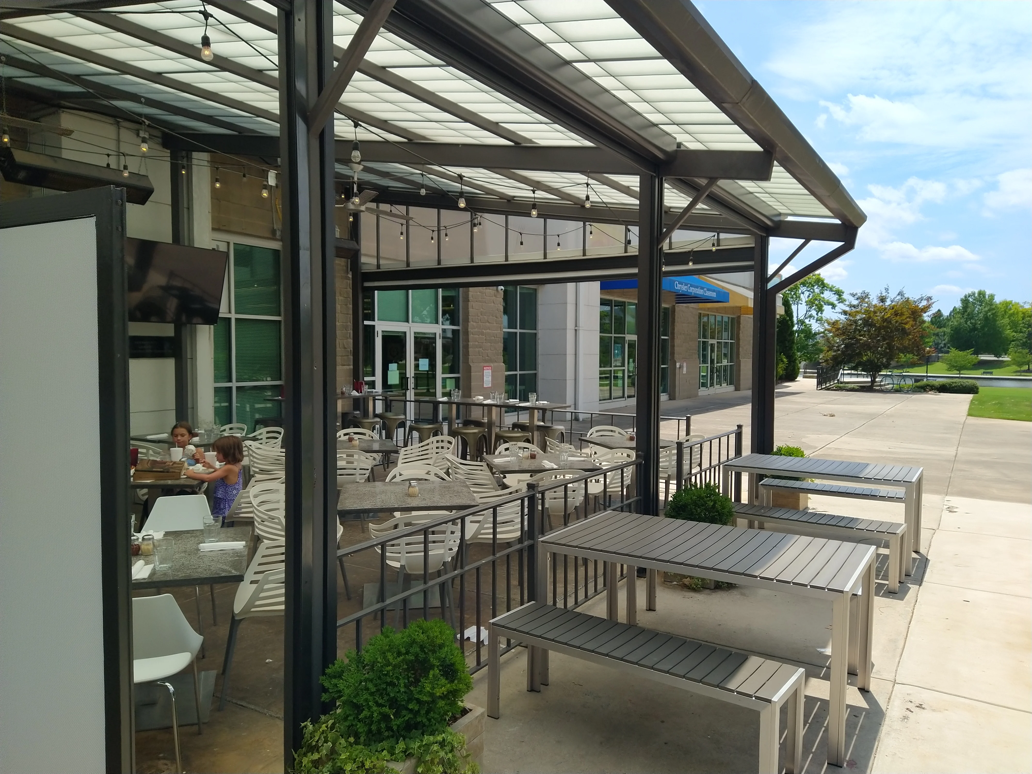 Outdoor dining area with modern tables and seating