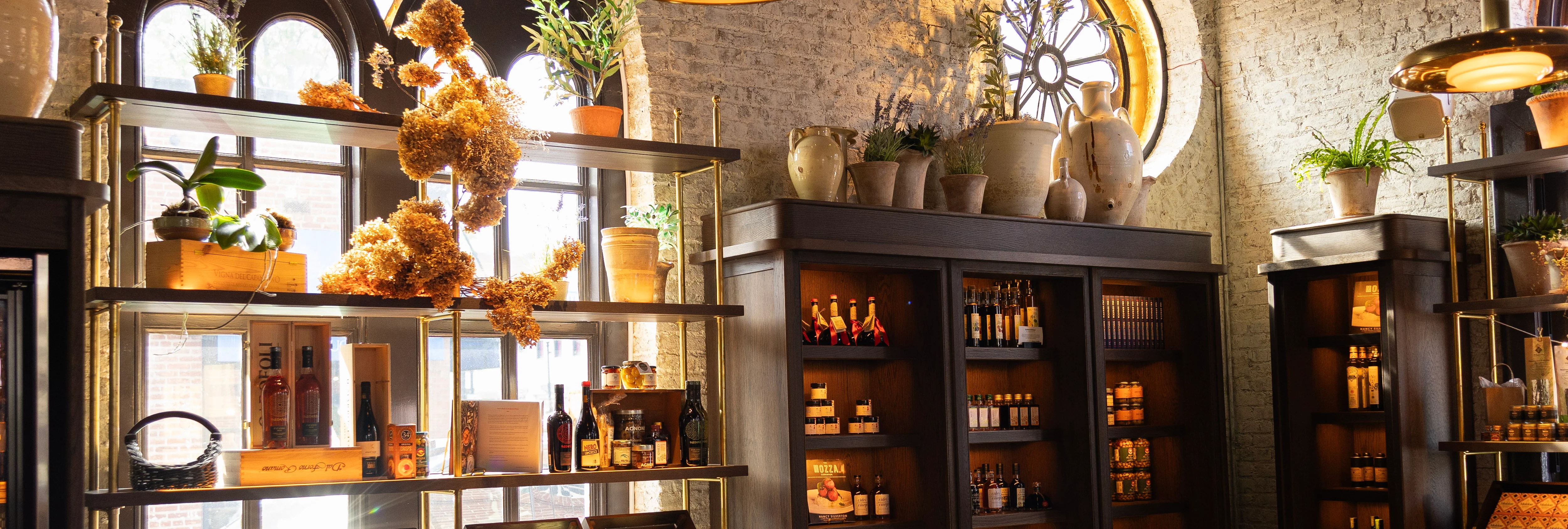 Stylish restaurant interior with shelves of gourmet products