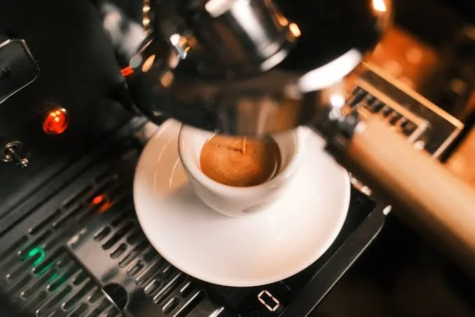Freshly brewed espresso shot in a white cup