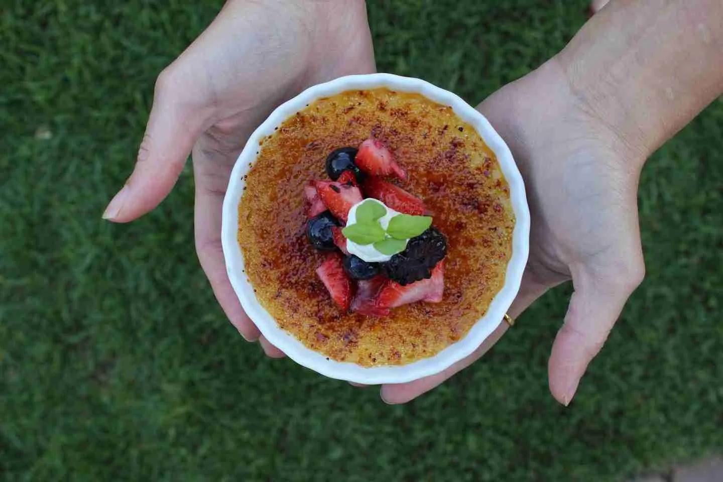 Classic French crème brûlée topped with fresh berries