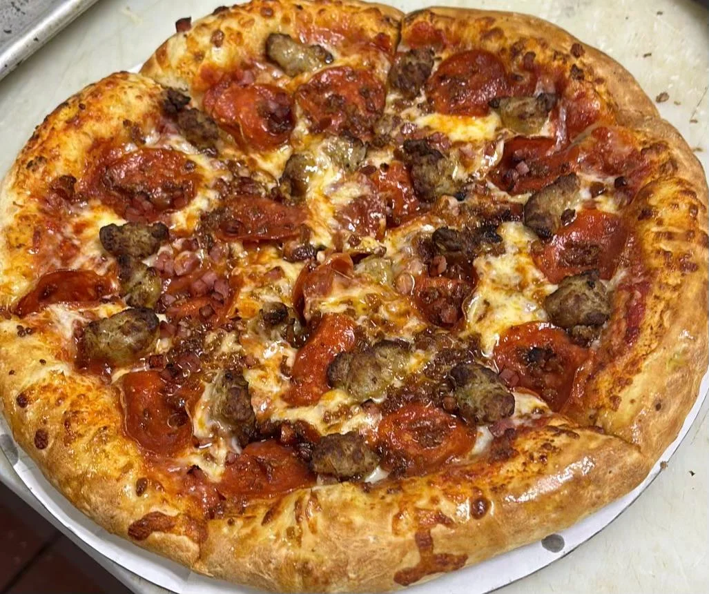 Loaded meat lover's pizza with pepperoni and sausage