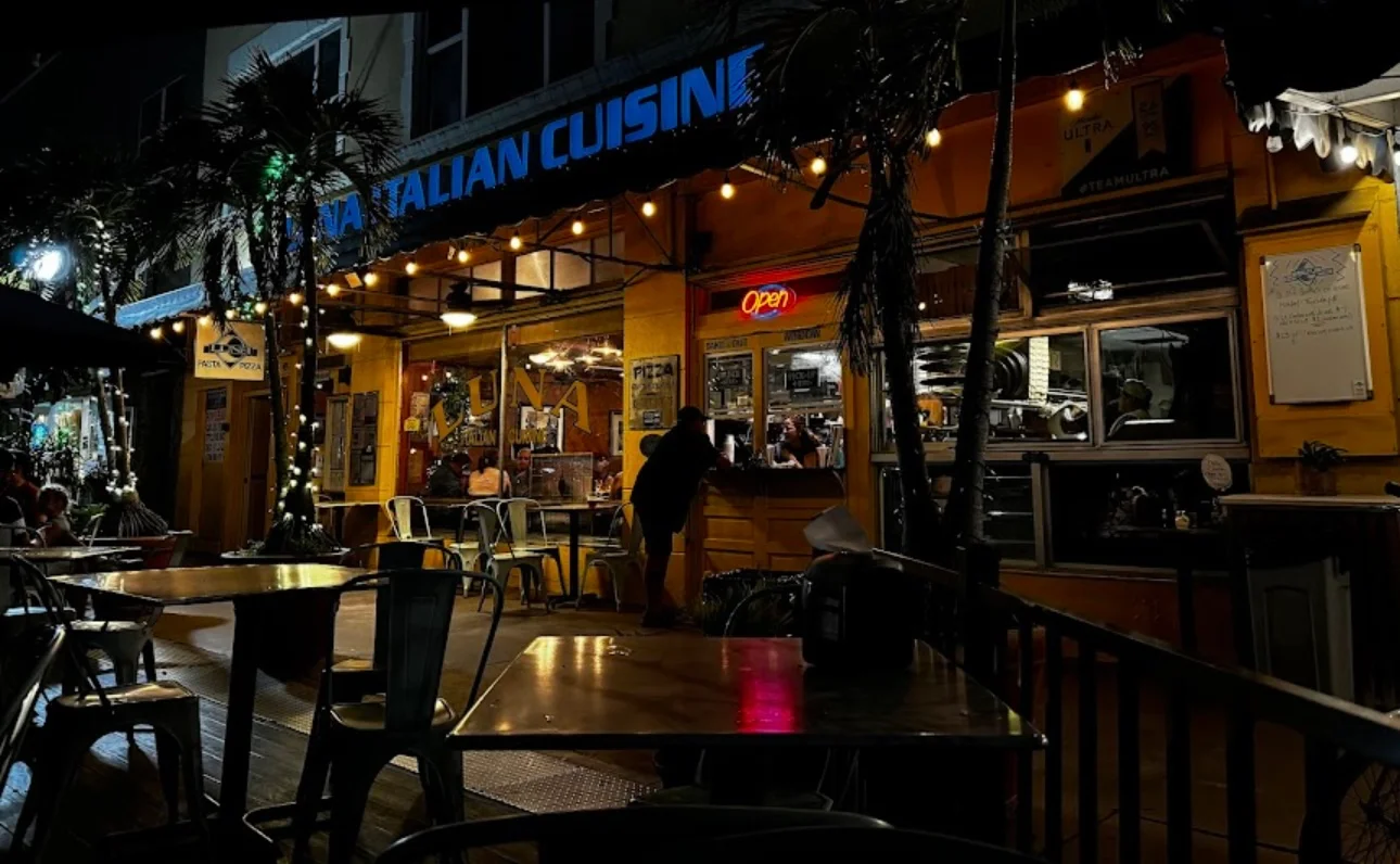 Charming Italian restaurant exterior at night