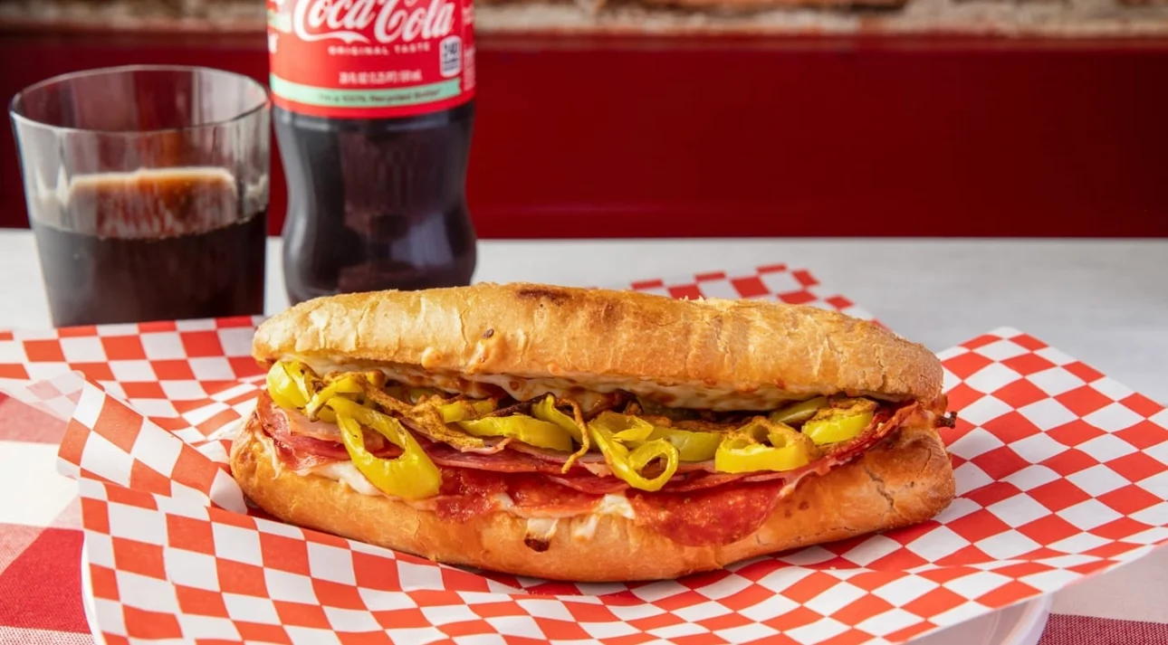 Italian sub sandwich with salami and peppers