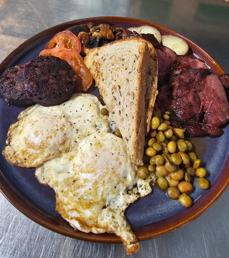 Traditional Irish breakfast with eggs, sausage, and toast