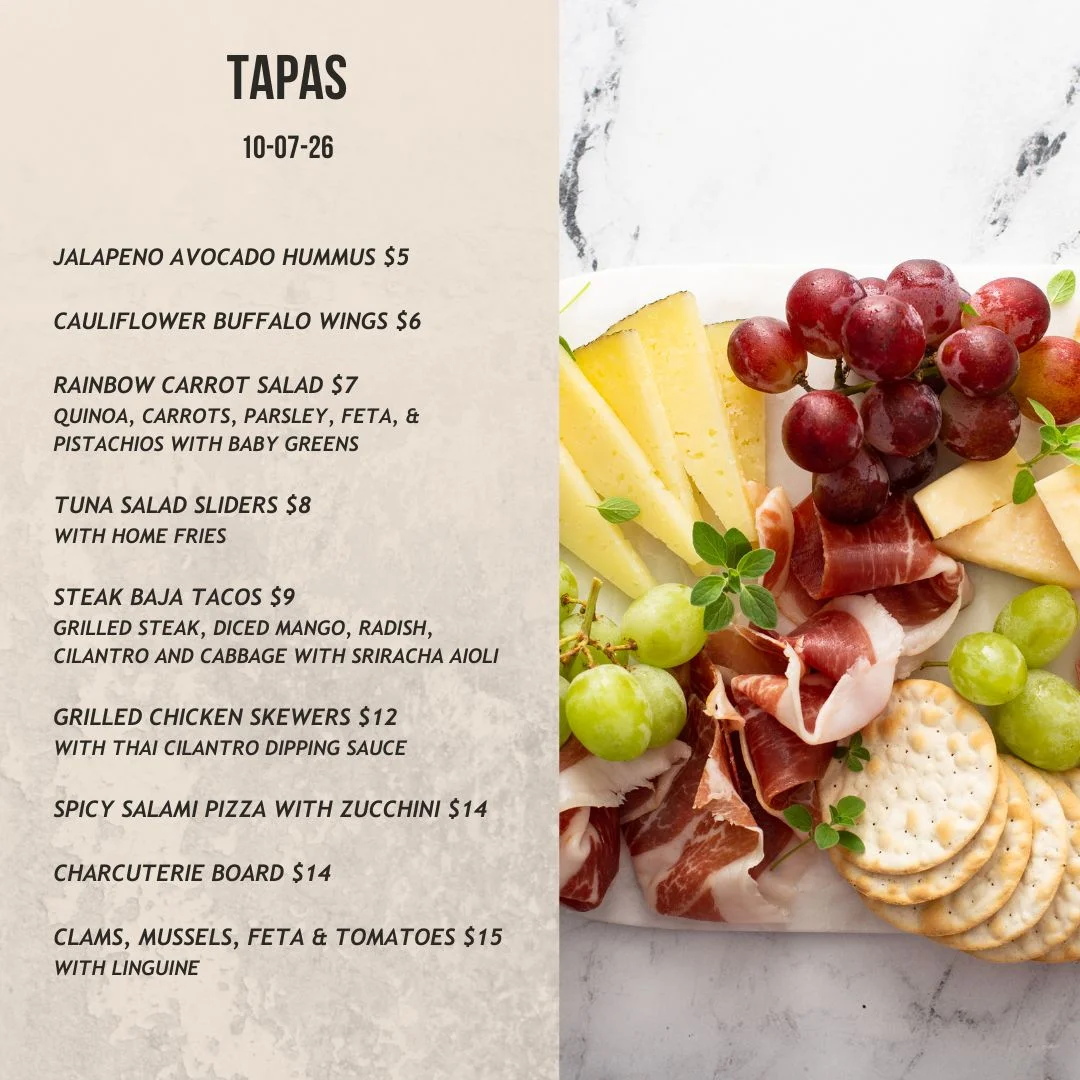 Spanish tapas menu featuring a beautifully arranged charcuterie board