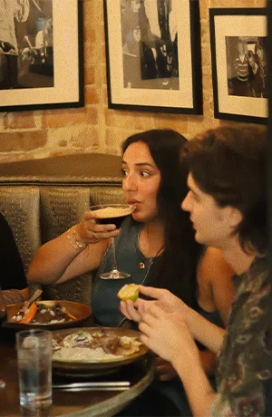 Friends drinking and eating on a night out