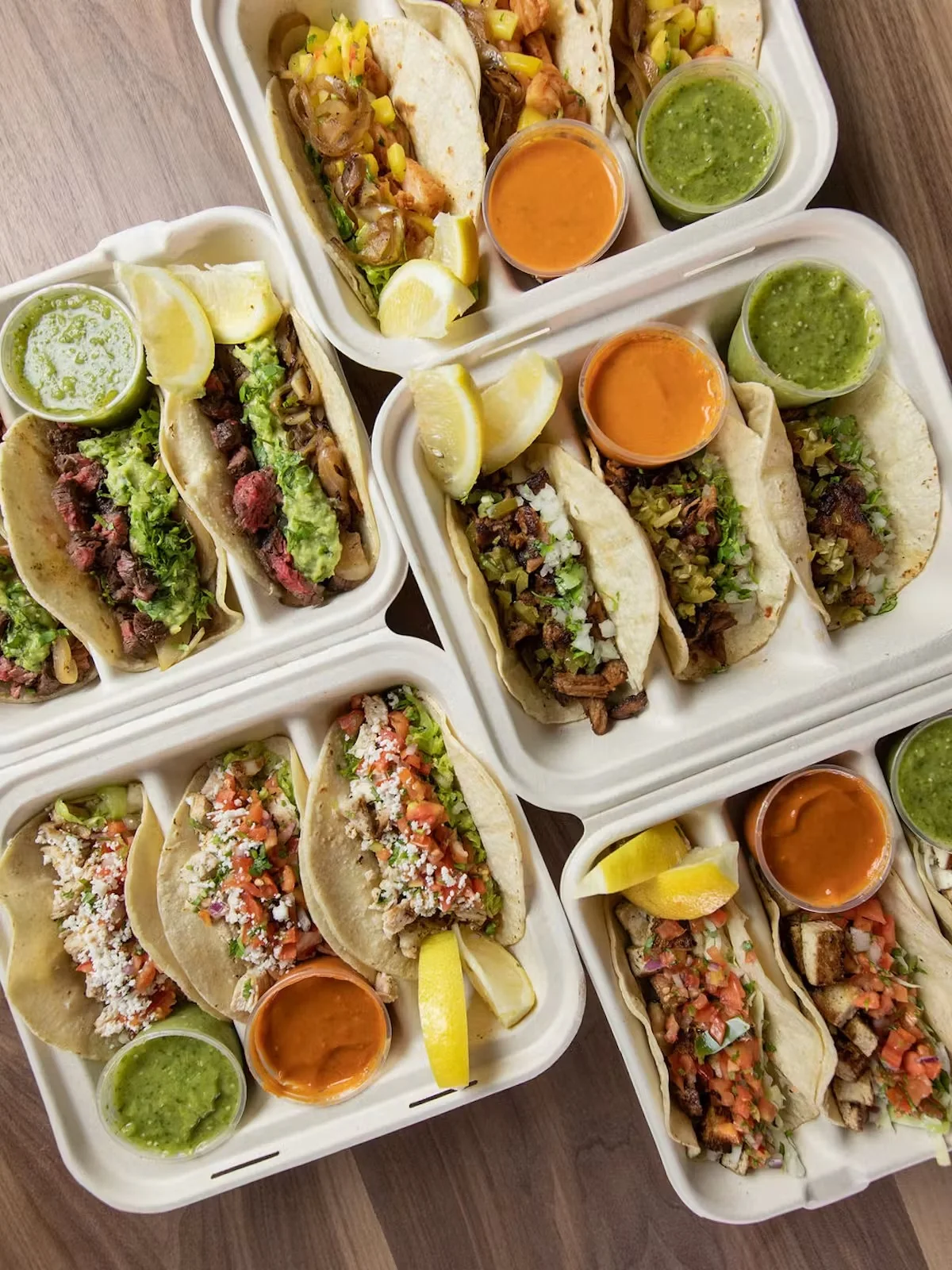 Assorted Mexican tacos with vibrant salsas and fresh toppings