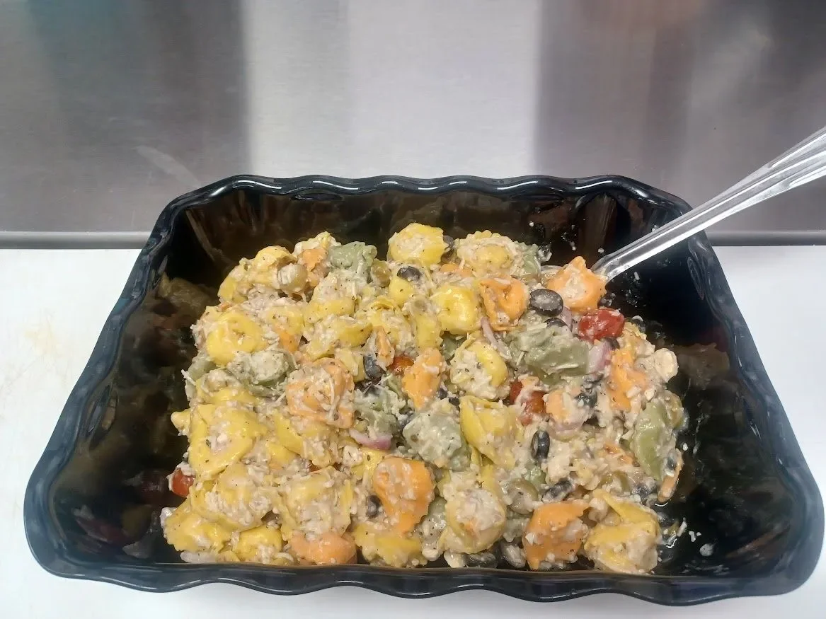 Colorful pasta salad with vegetables and creamy dressing