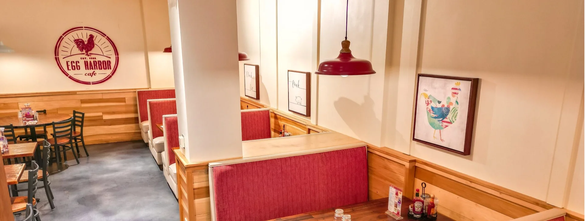 Cozy restaurant interior with wooden accents and red booths