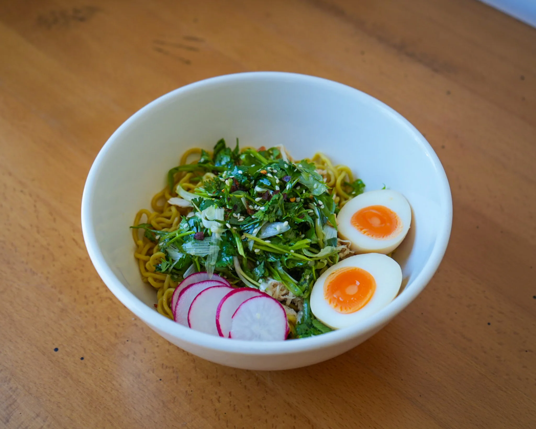 Japanese cold soba noodles with soft-boiled eggs and fresh greens