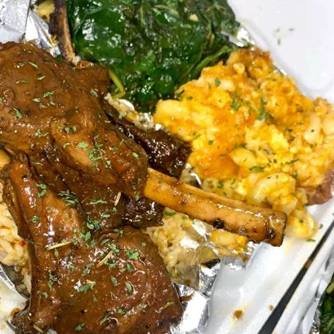 Southern-style lamb chops with sides of macaroni and greens