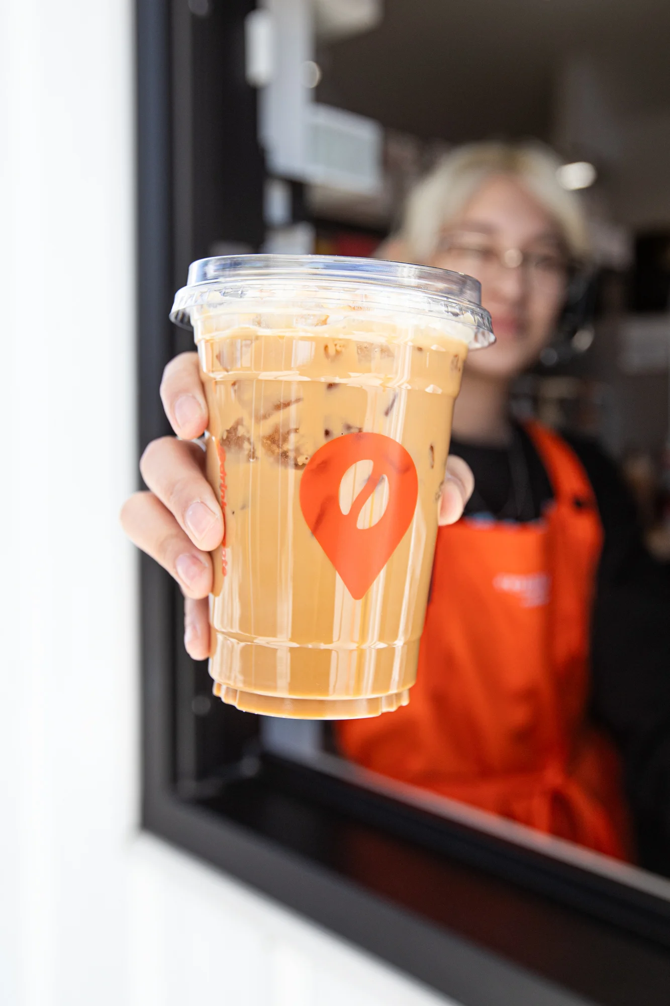 Iced coffee drink served in a clear cup