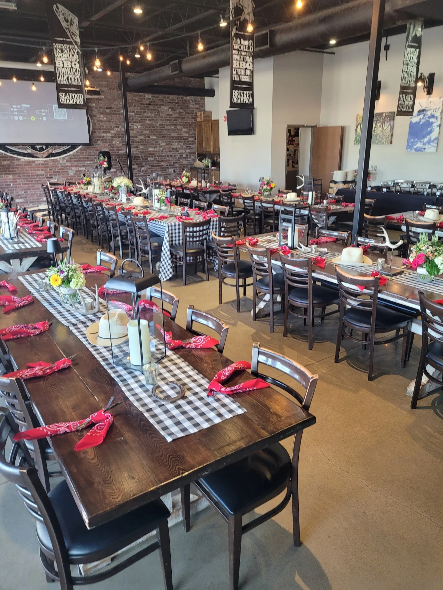 Elegant restaurant dining hall with stylish decor and table settings.
