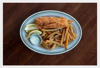 Crispy fish and chips served with lemon and tartar sauce