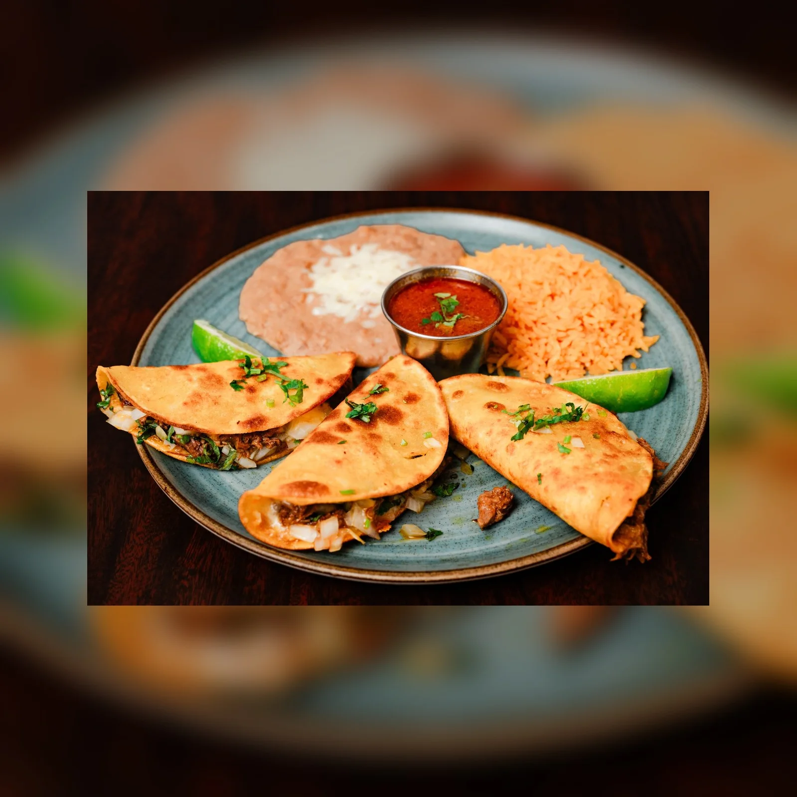 Plate of Mexican tacos with rice and beans