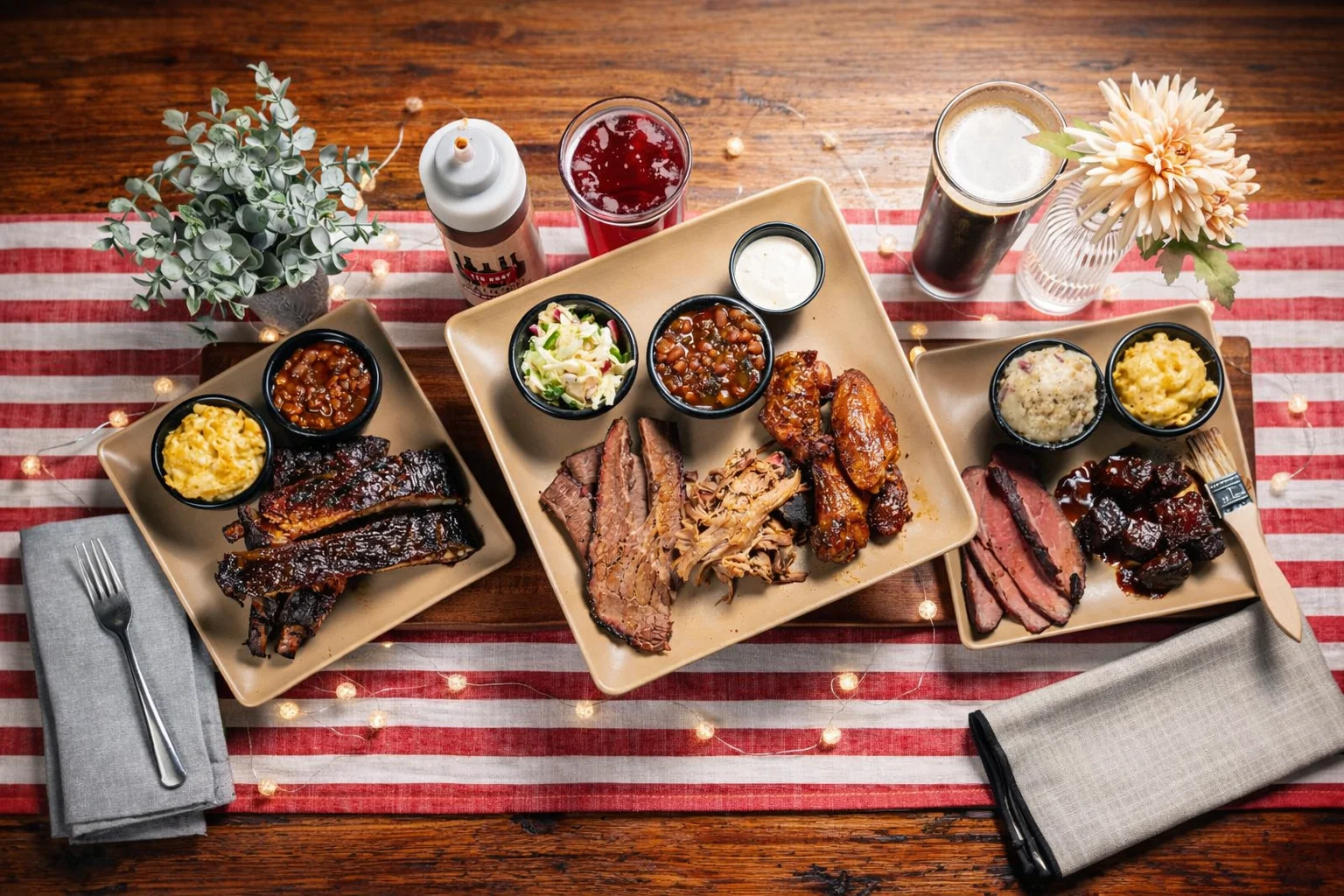 ribs on a plate with baked beans and mac n cheese