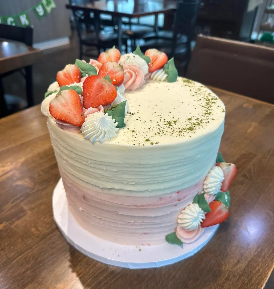 Elegant layered strawberry cake with cream frosting