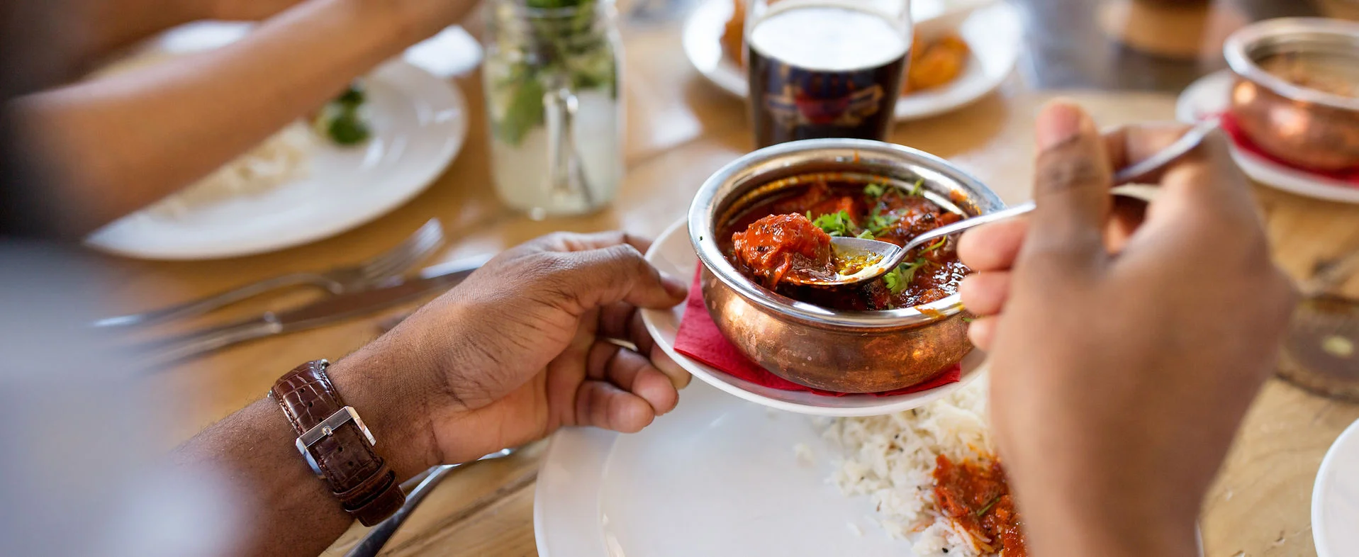 Delicious Indian curry served in a traditional copper bowl